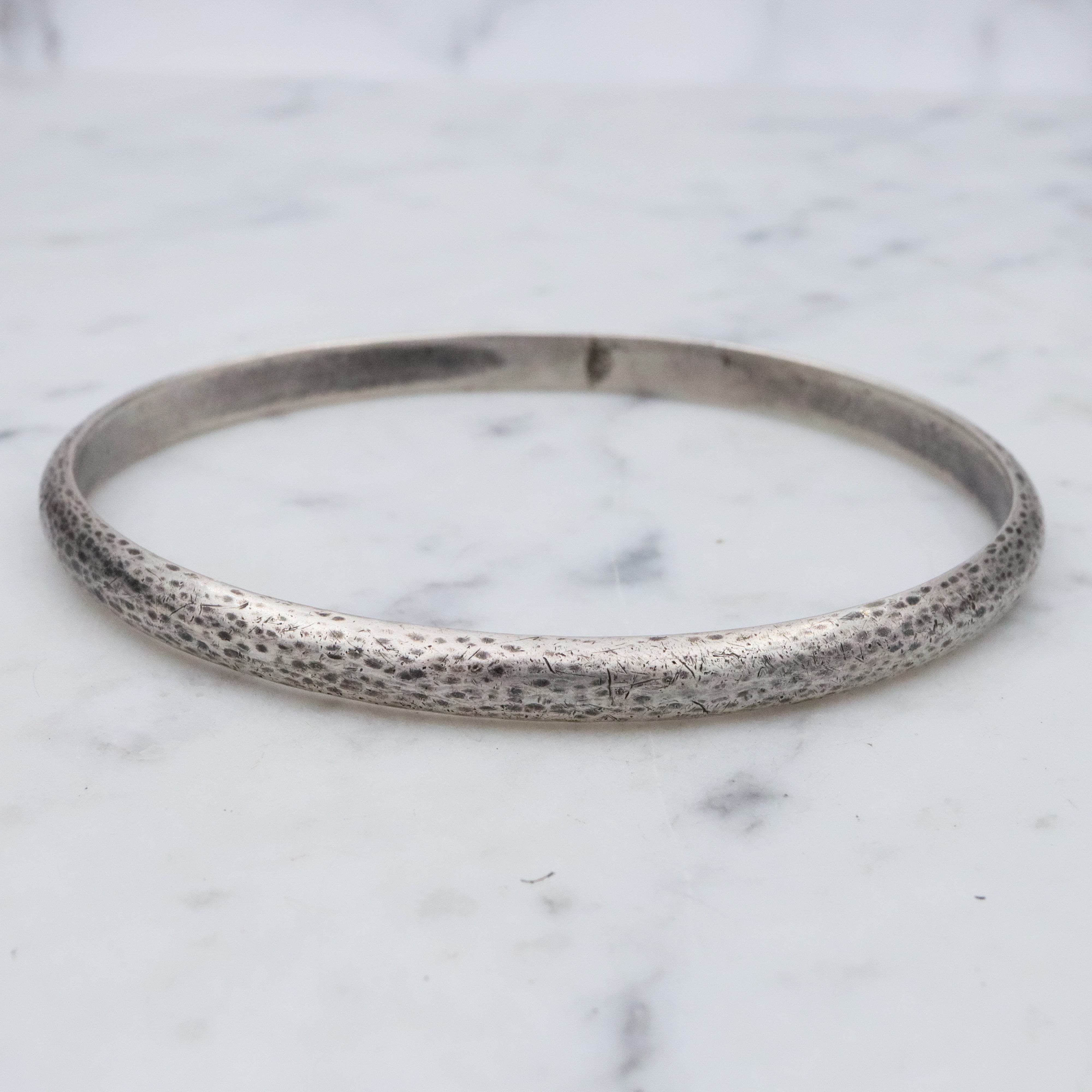 Mid Century hand hammered solid sterling oval bangle